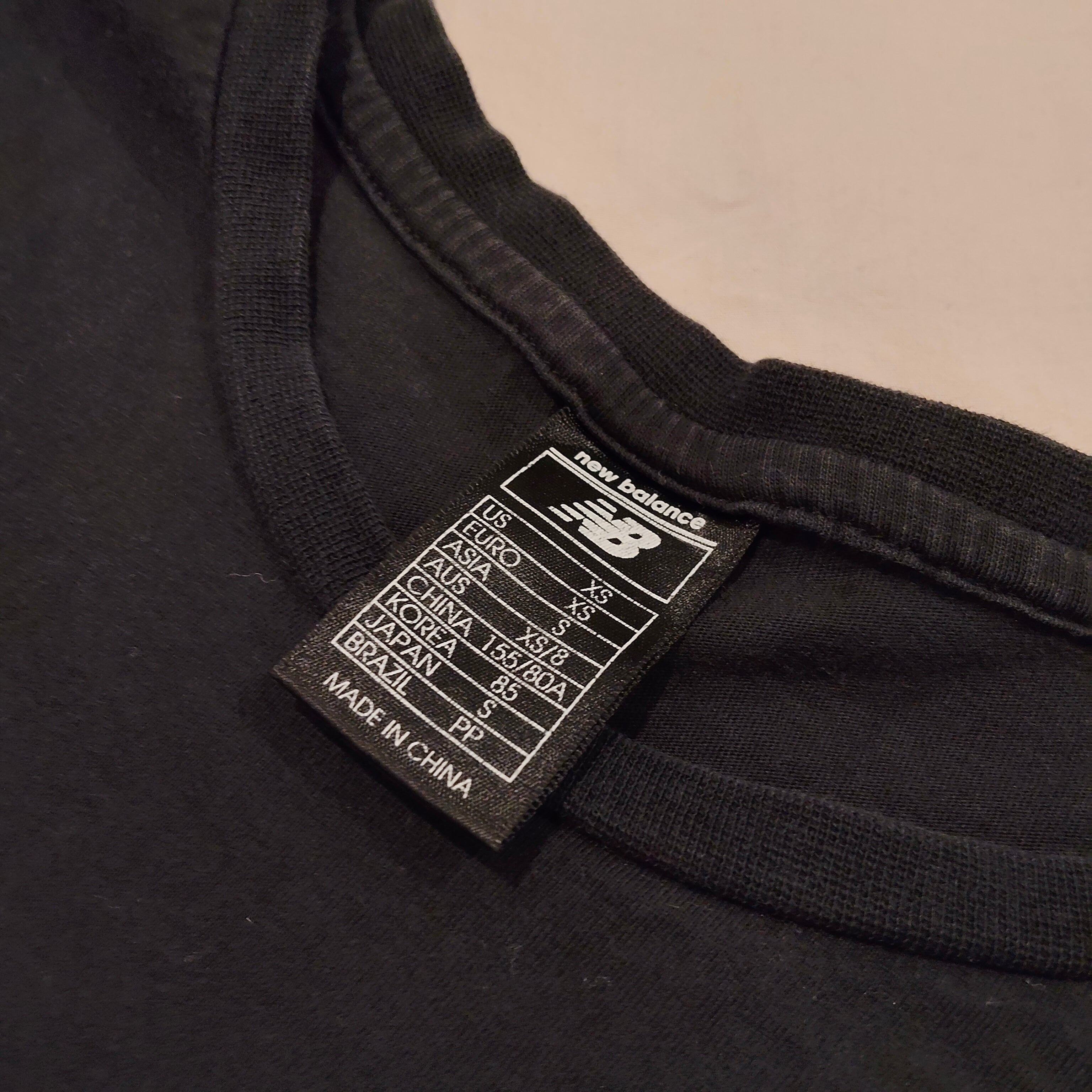 NEW BALANCE tee size girls 6-8y black short sleeve
