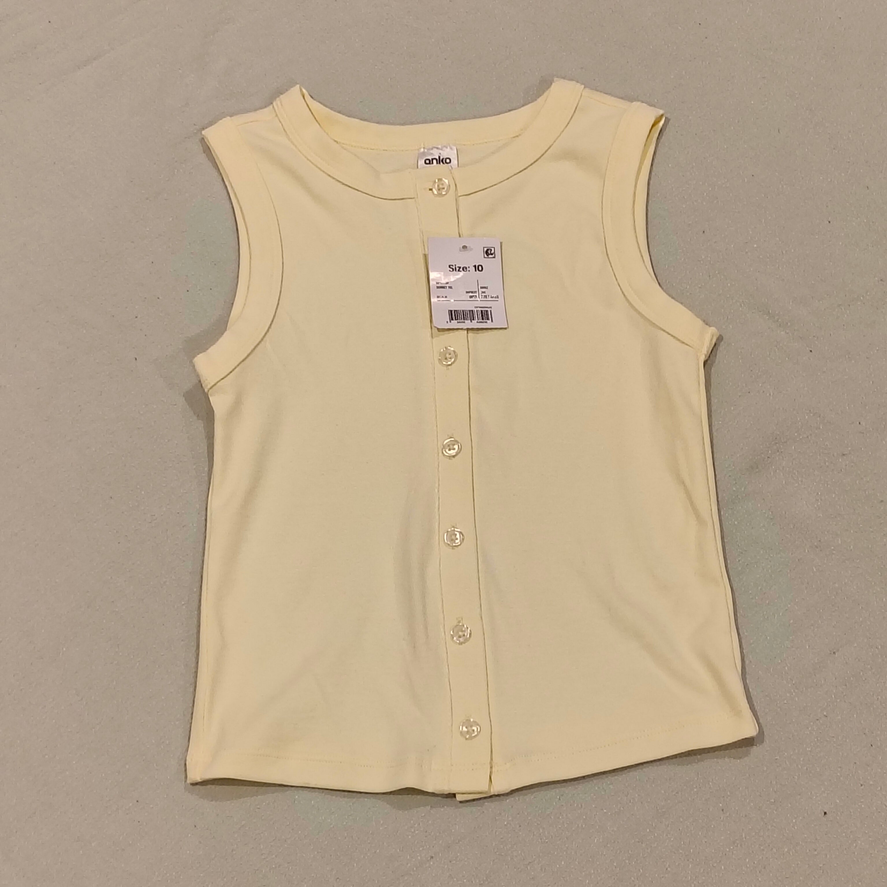 New top size 10yrs girls light yellow sleeveless