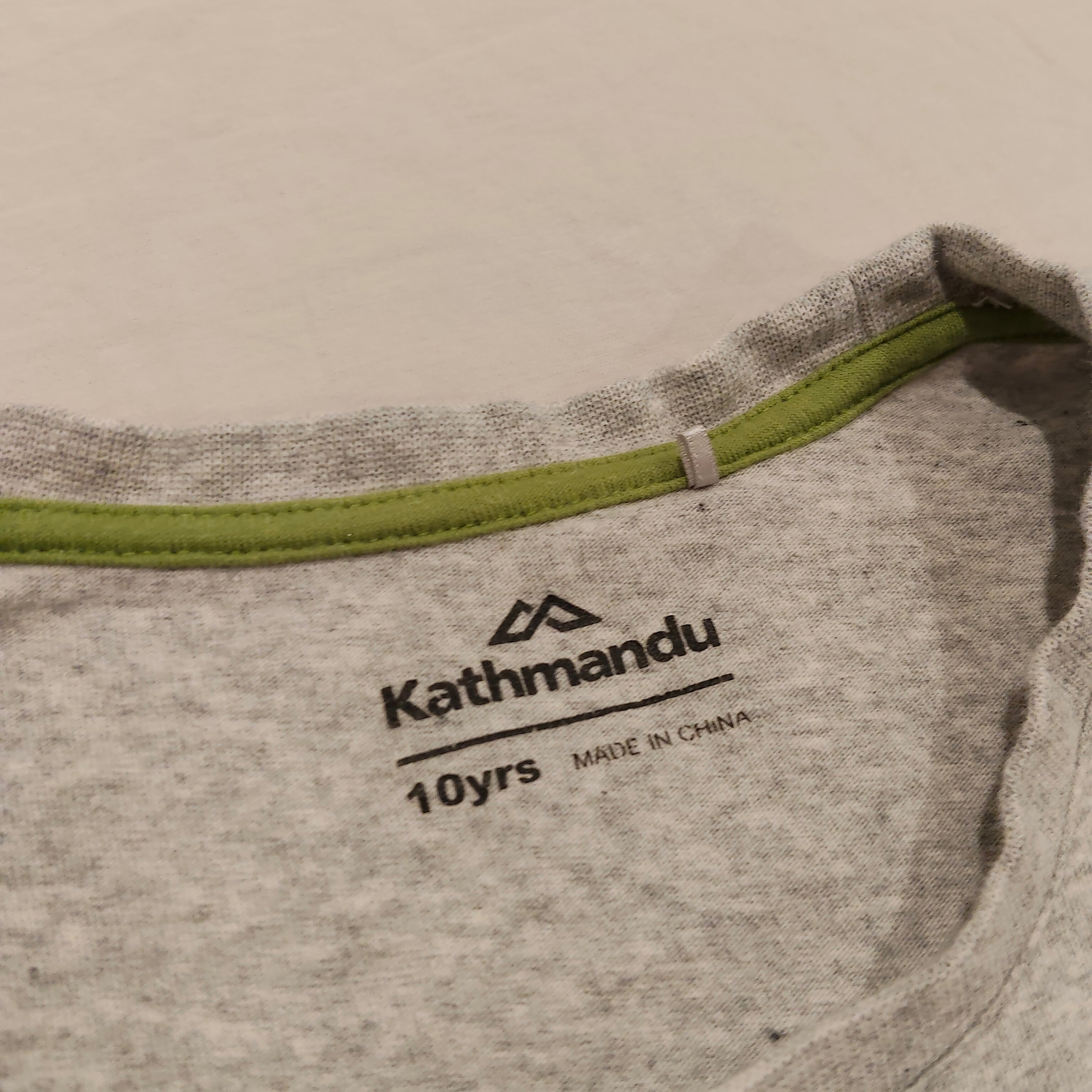 KATHMANDU top size 10yrs girls short sleeve "Travelling With You"