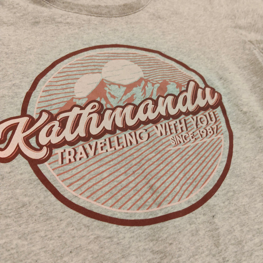 KATHMANDU top size 10yrs girls short sleeve "Travelling With You"