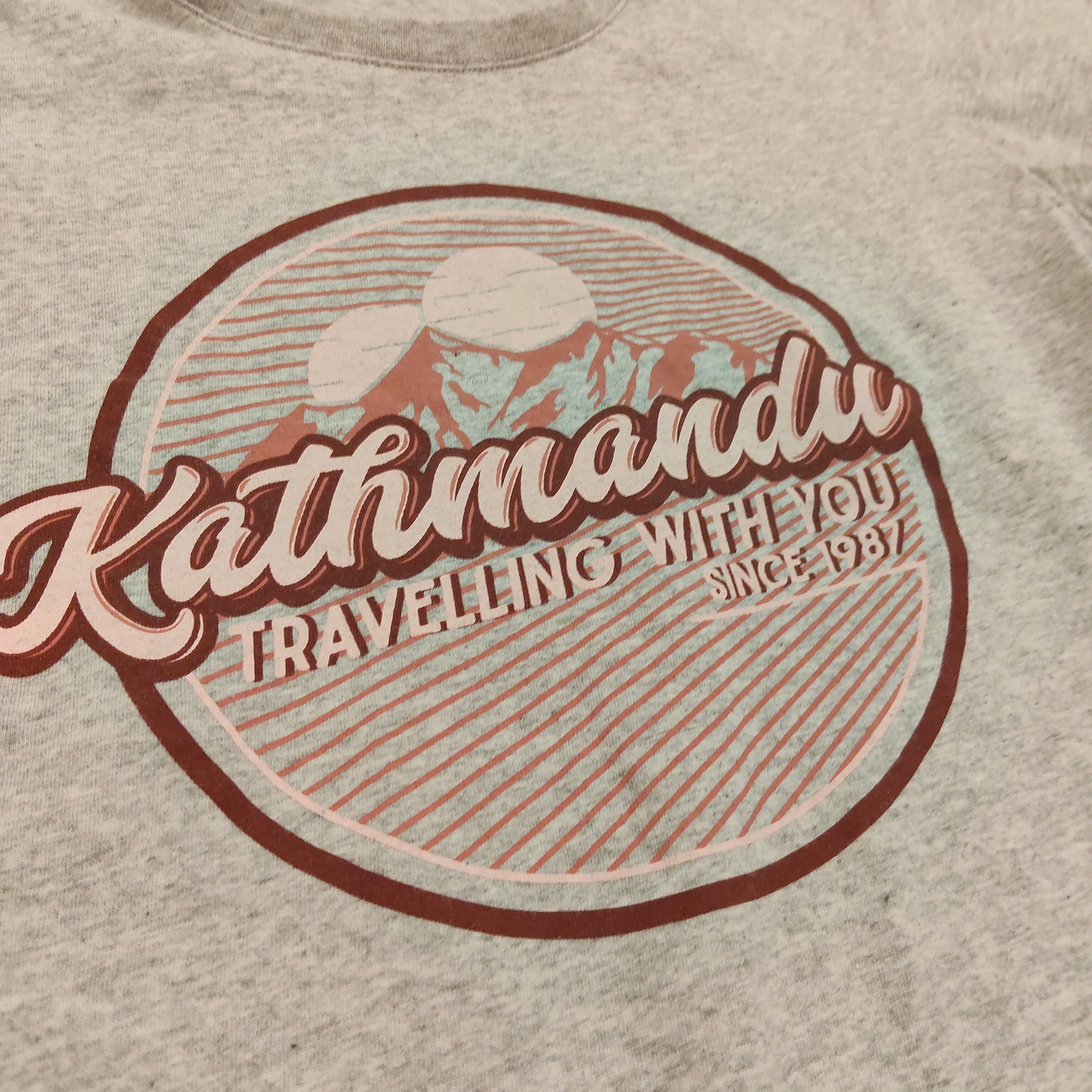 KATHMANDU top size 10yrs girls short sleeve "Travelling With You"